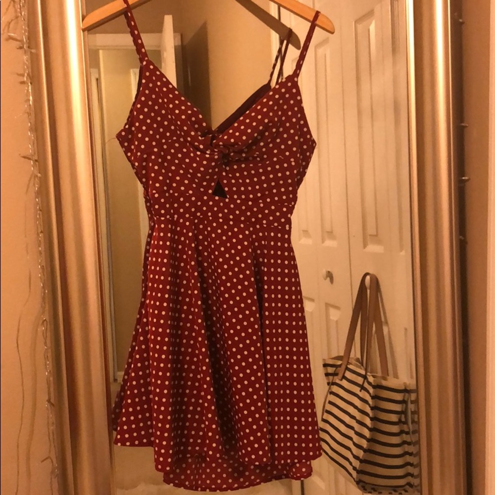 Flirty red and white polka dot open back dress